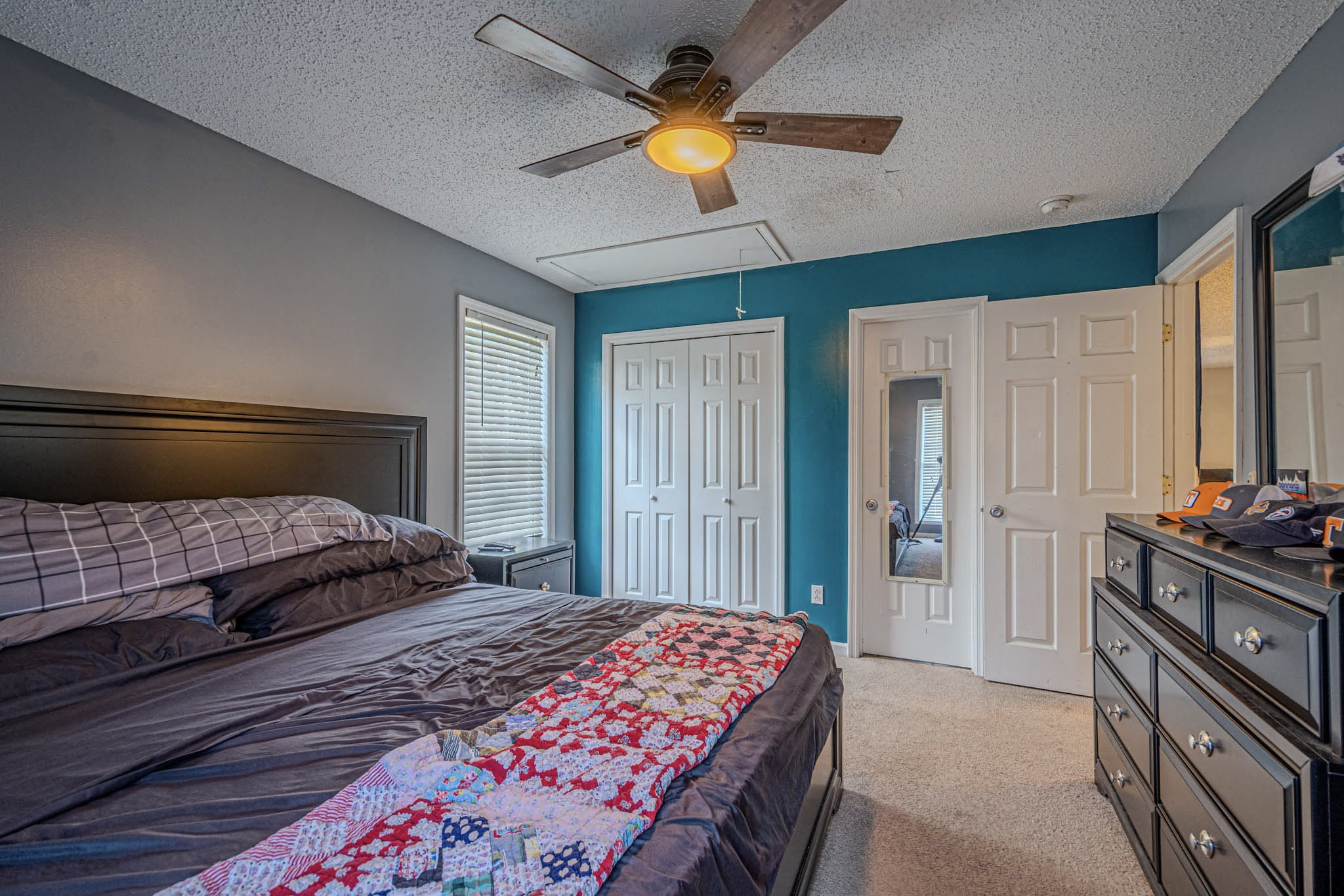 25230 Union Hill Road Ardmore, TN 38449 - Photo 34 of 55 a bedroom with a bed and a chandelier