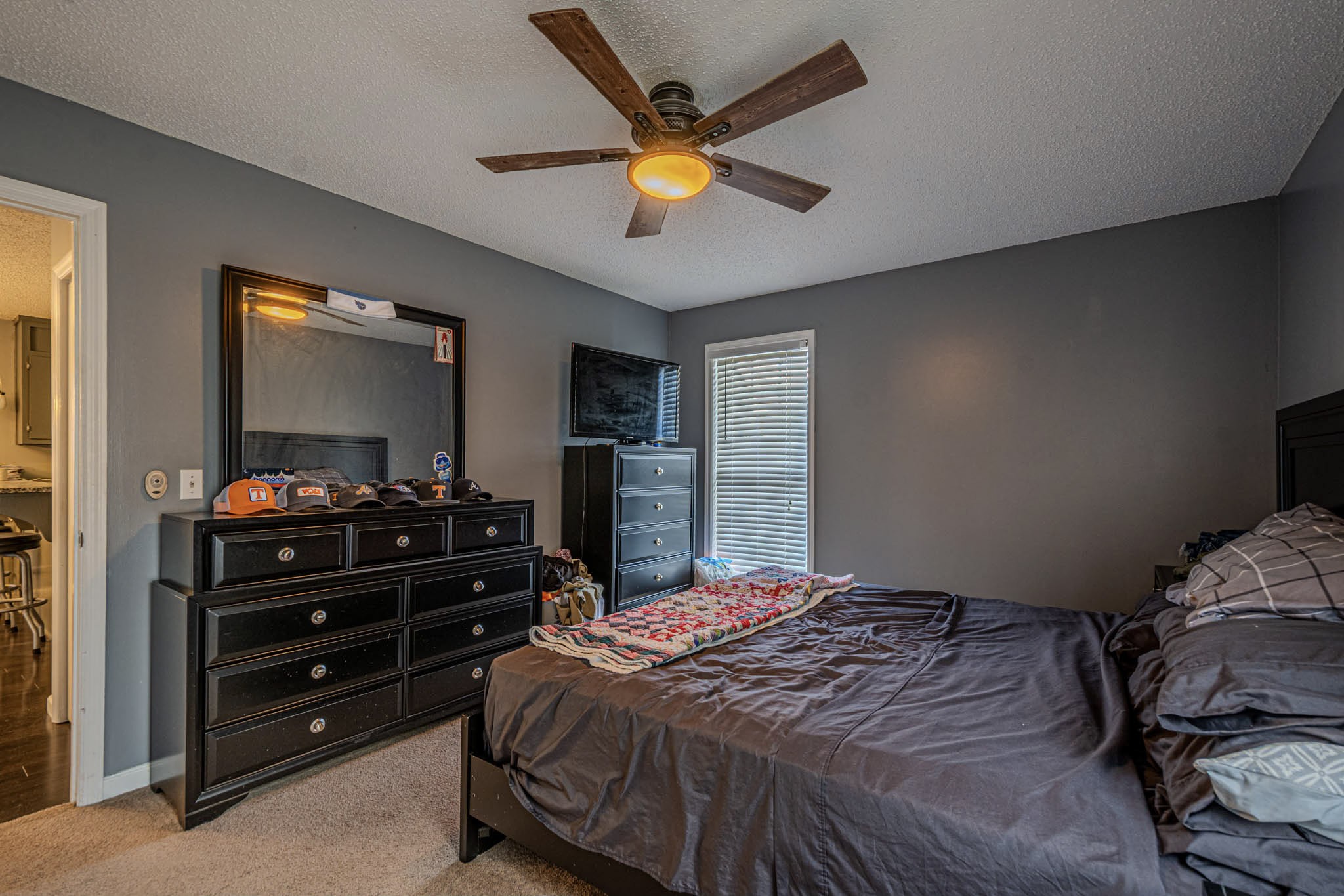 25230 Union Hill Road Ardmore, TN 38449 - Photo 35 of 55 a bedroom with a bed and a chandelier