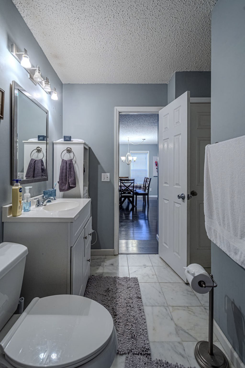 25230 Union Hill Road Ardmore, TN 38449 - Photo 41 of 55 a bathroom with a sink a toilet a mirror and vanity