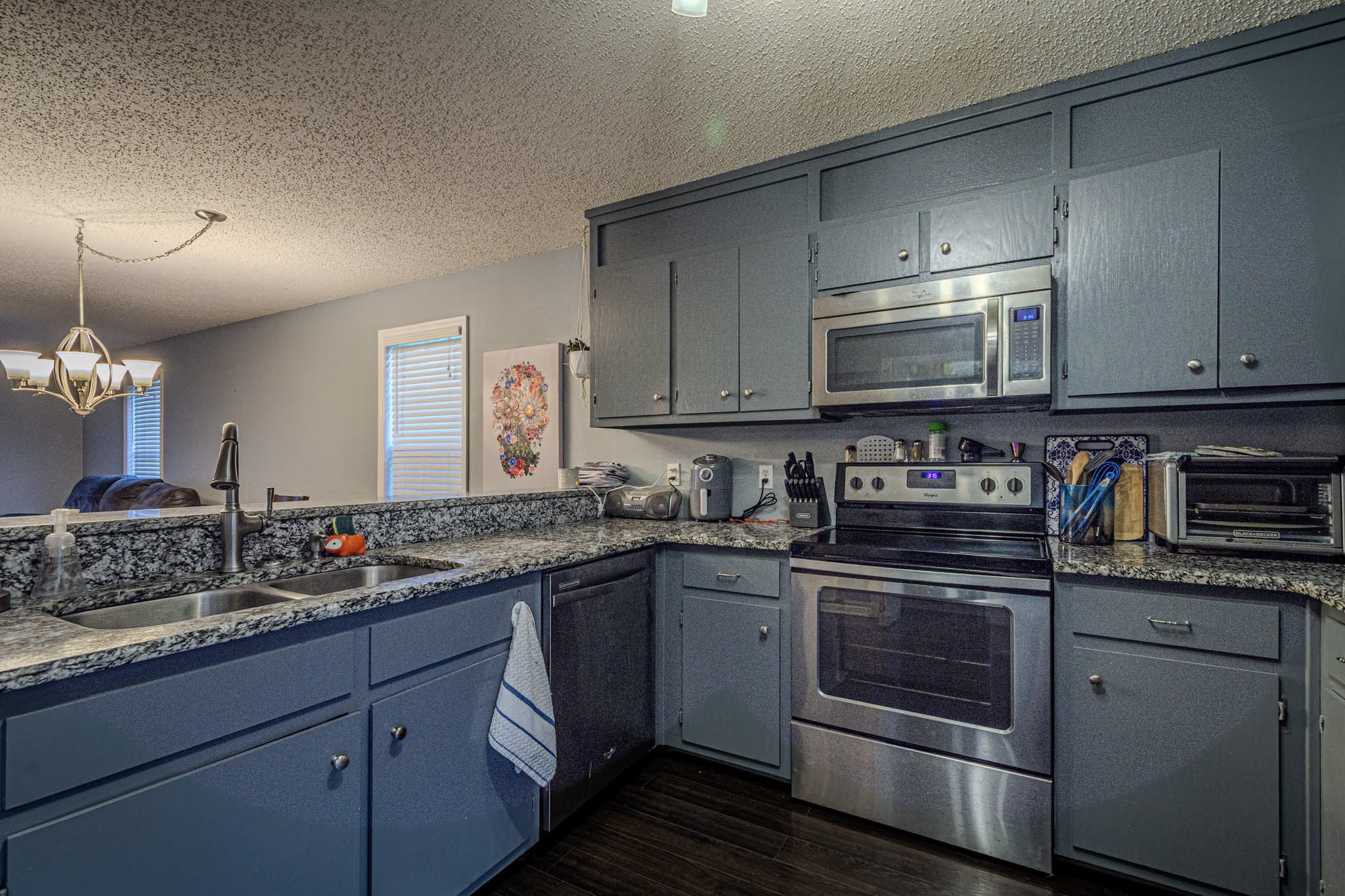 25230 Union Hill Road Ardmore, TN 38449 - Photo 49 of 55 a kitchen with stainless steel appliances granite countertop a sink stove and cabinets
