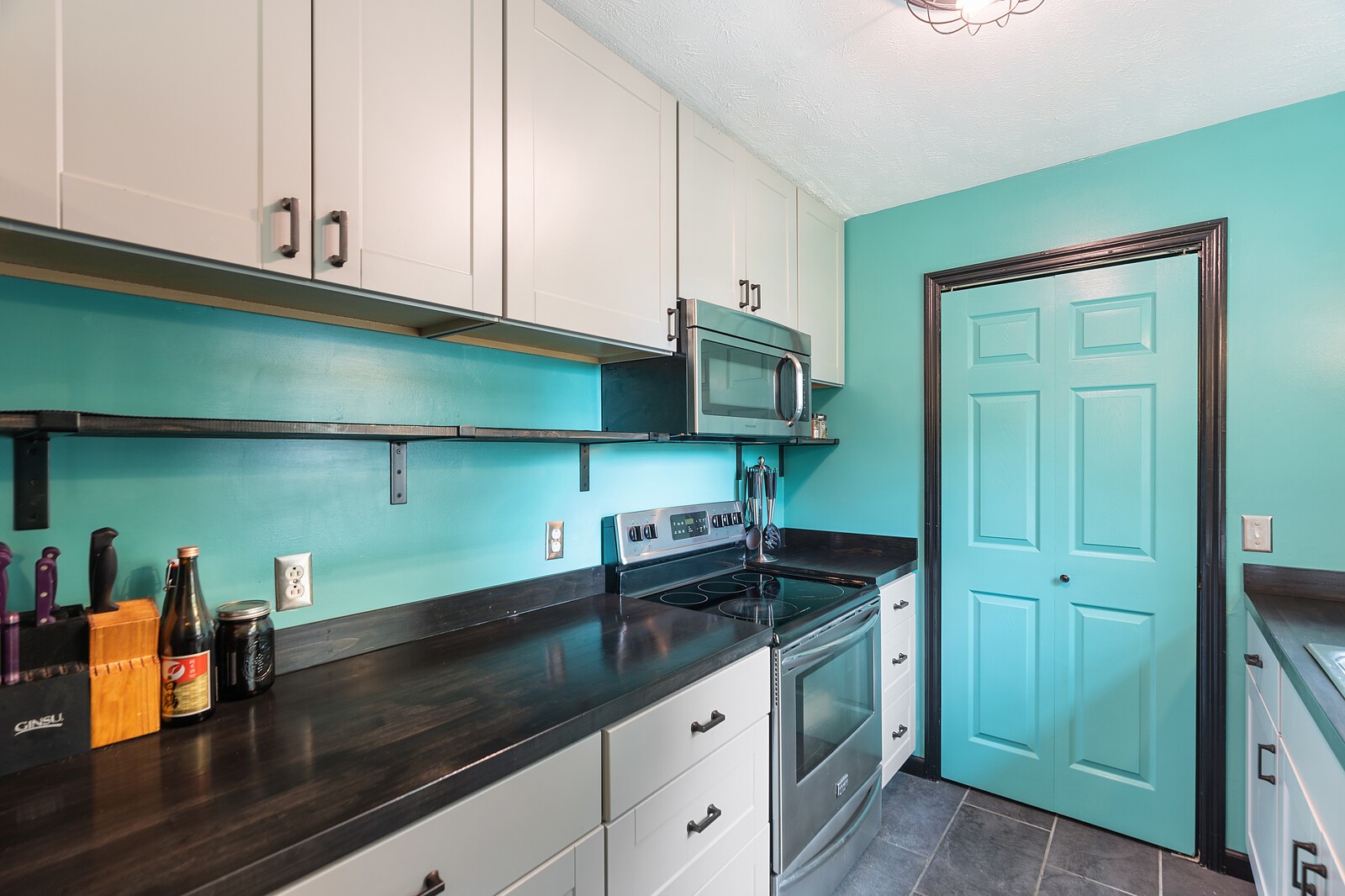 6658 Highway 49 Springfield, TN 37172 - Photo 14 of 44 a kitchen with stainless steel appliances granite countertop a sink a stove and cabinets