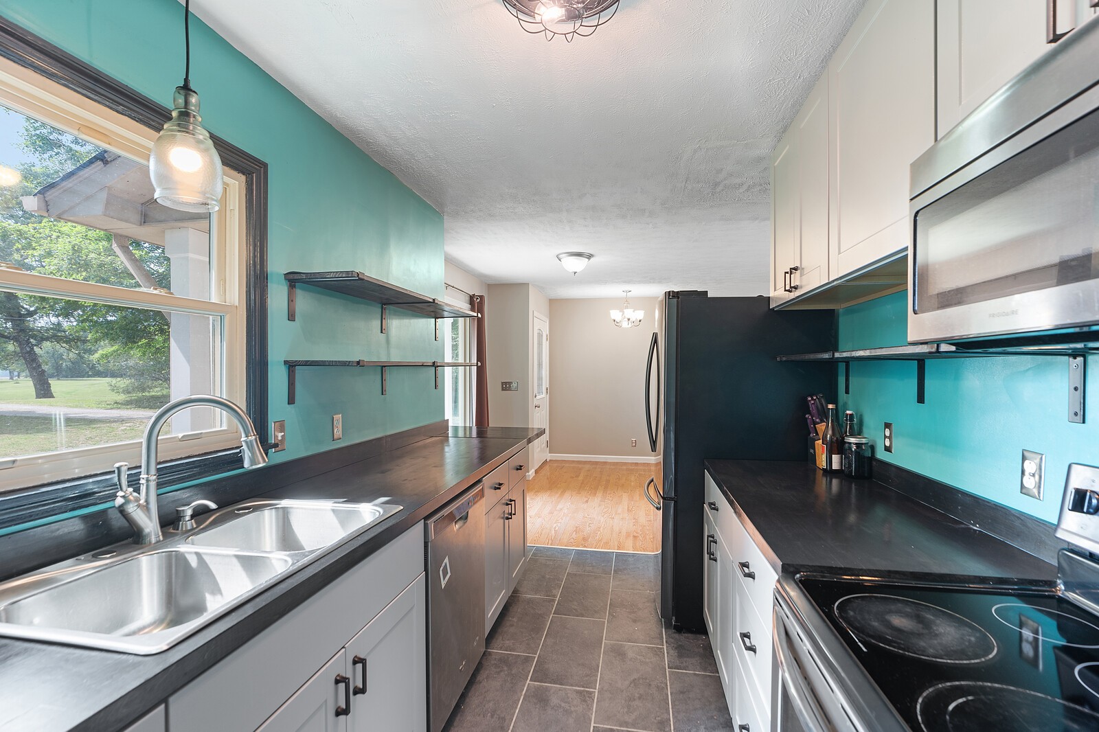 6658 Highway 49 Springfield, TN 37172 - Photo 15 of 44 a kitchen with stainless steel appliances a sink stove and cabinets