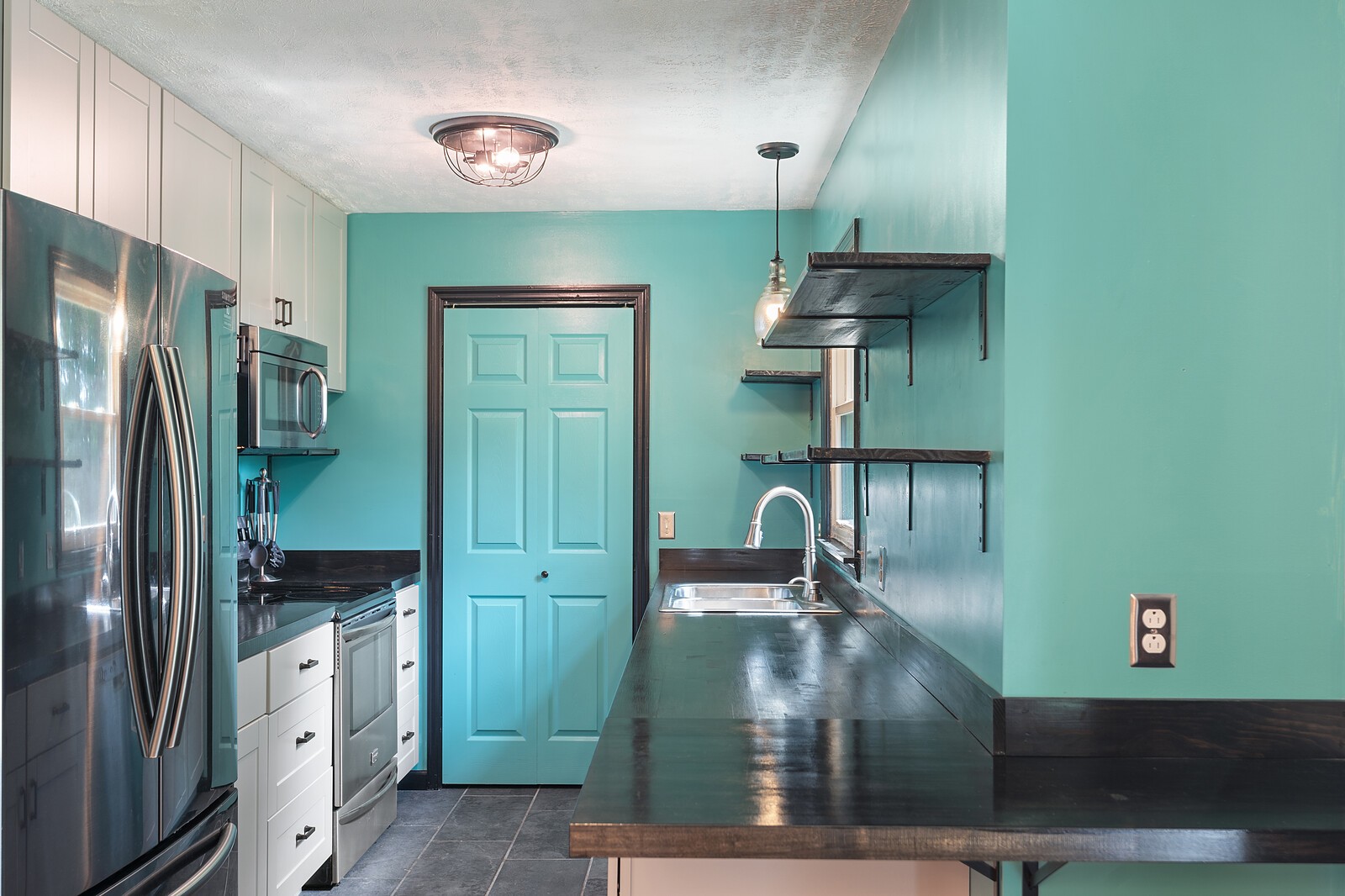 6658 Highway 49 Springfield, TN 37172 - Photo 3 of 44 a kitchen with kitchen island a counter top space cabinets and stainless steel appliances