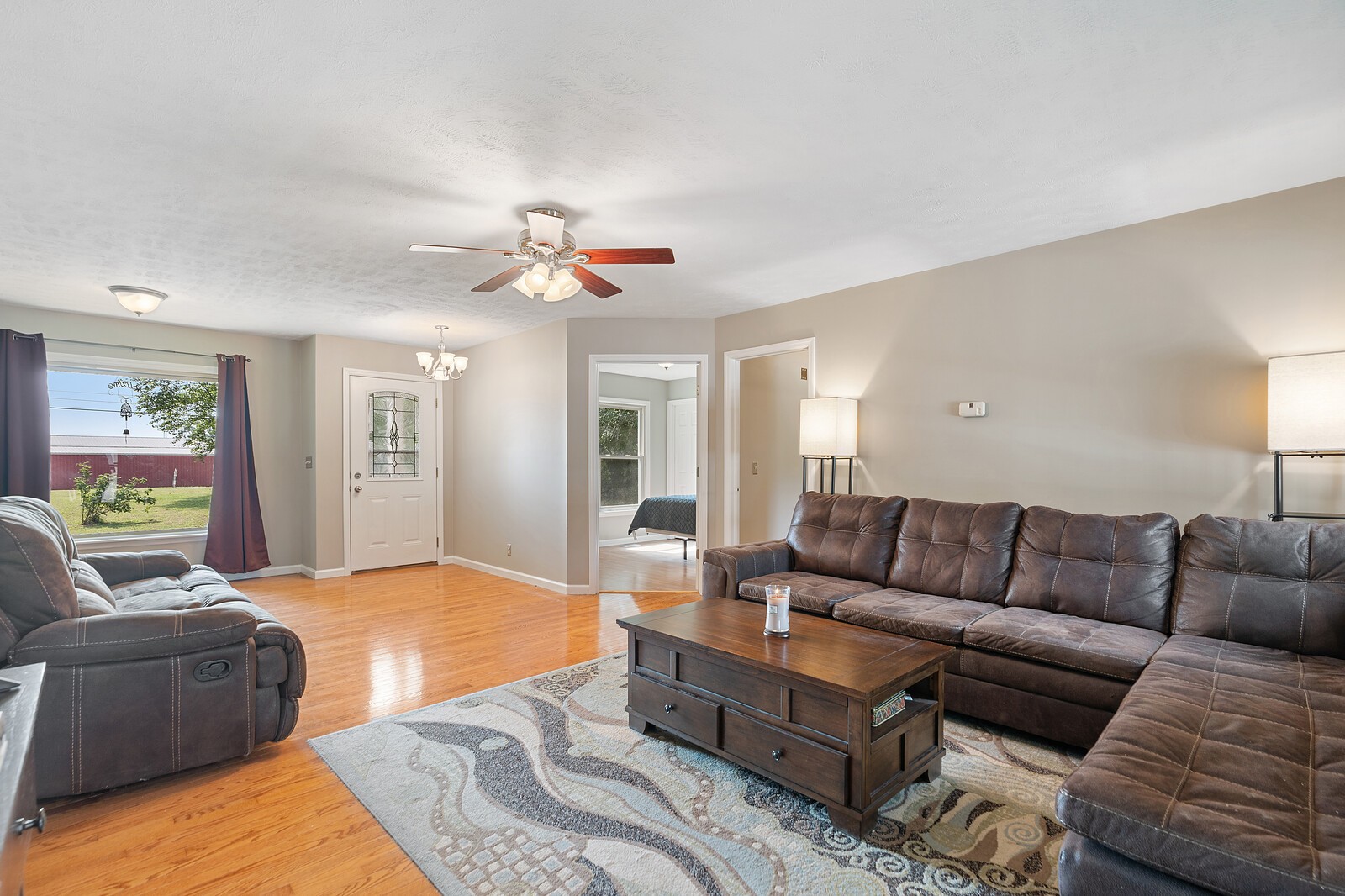 6658 Highway 49 Springfield, TN 37172 - Photo 22 of 44 a living room with furniture ceiling fan and a rug