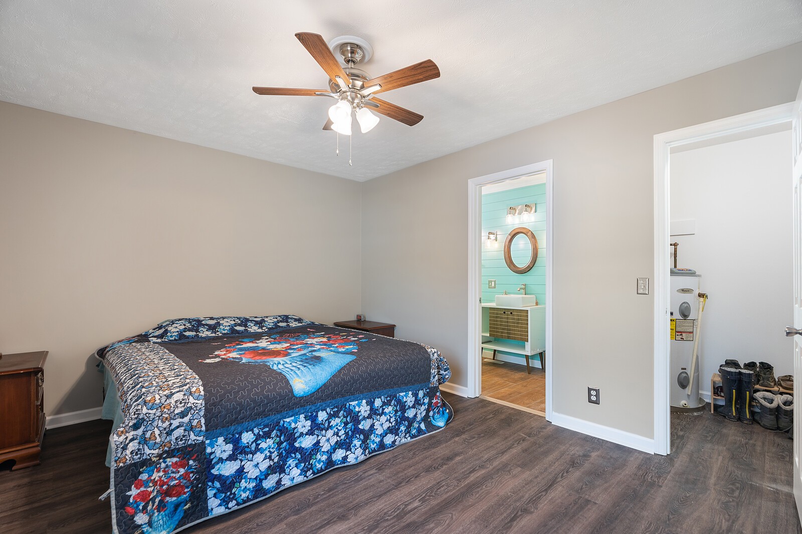 6658 Highway 49 Springfield, TN 37172 - Photo 24 of 44 a bedroom with a bed and a chandelier