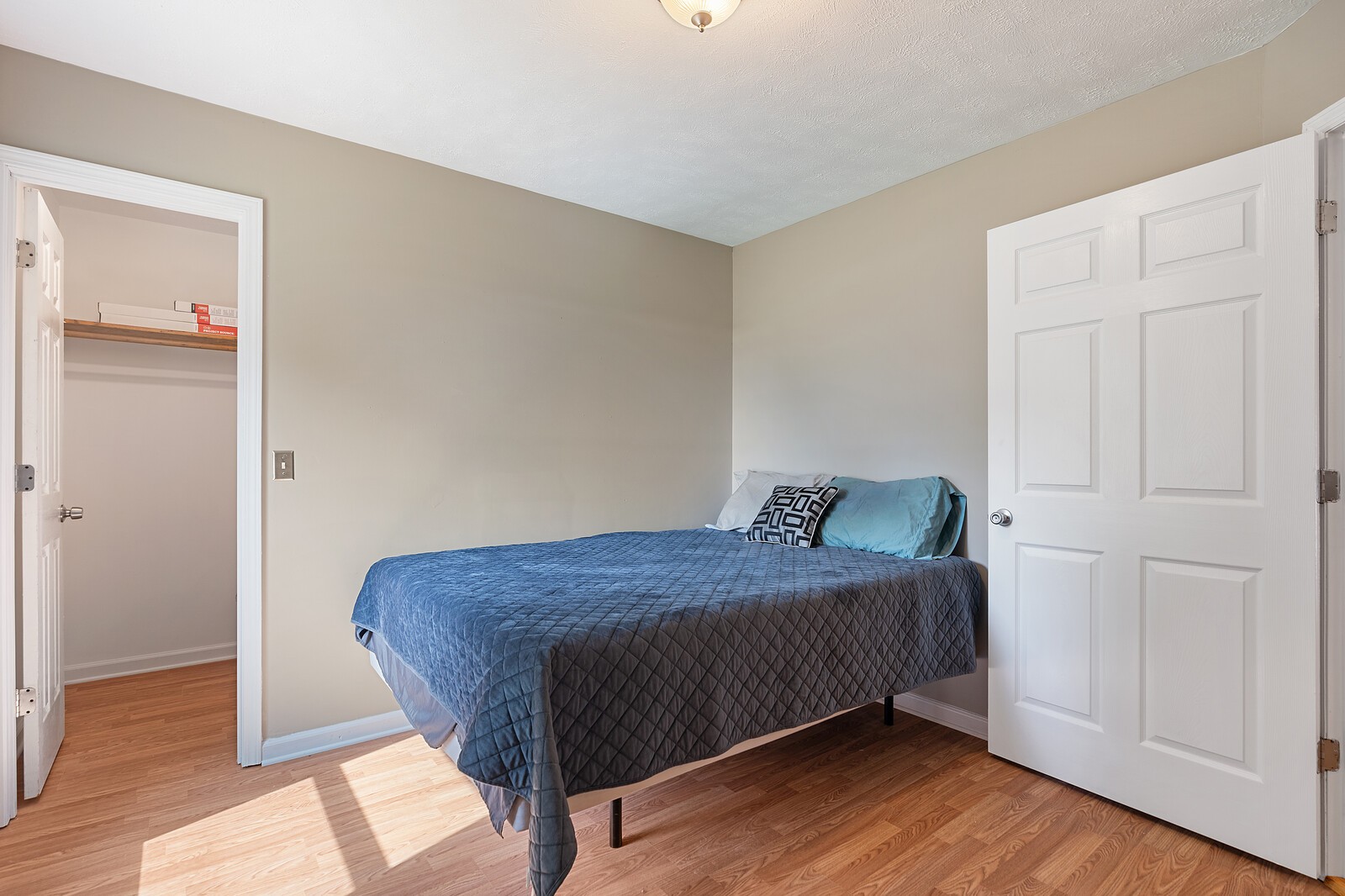 6658 Highway 49 Springfield, TN 37172 - Photo 28 of 44 a bedroom with a bed and wooden floor