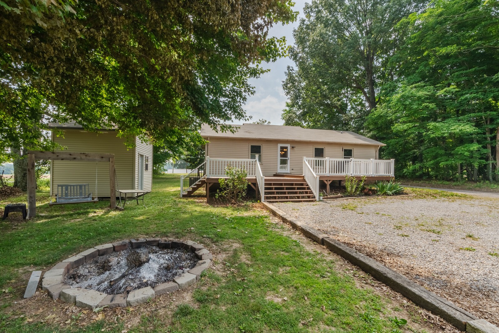 6658 Highway 49 Springfield, TN 37172 - Photo 7 of 44 a view of a house with backyard and trees