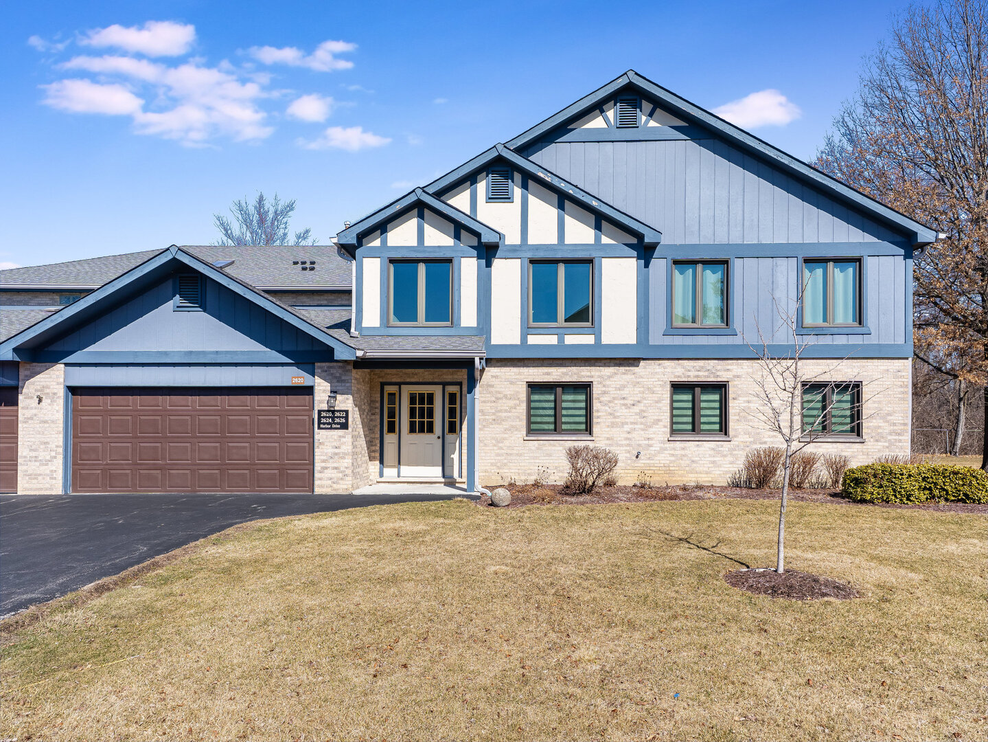 2626 Harbor Drive, Unit 2626 Joliet, IL 60431 - Photo 1 of 26 a front view of a house with garden