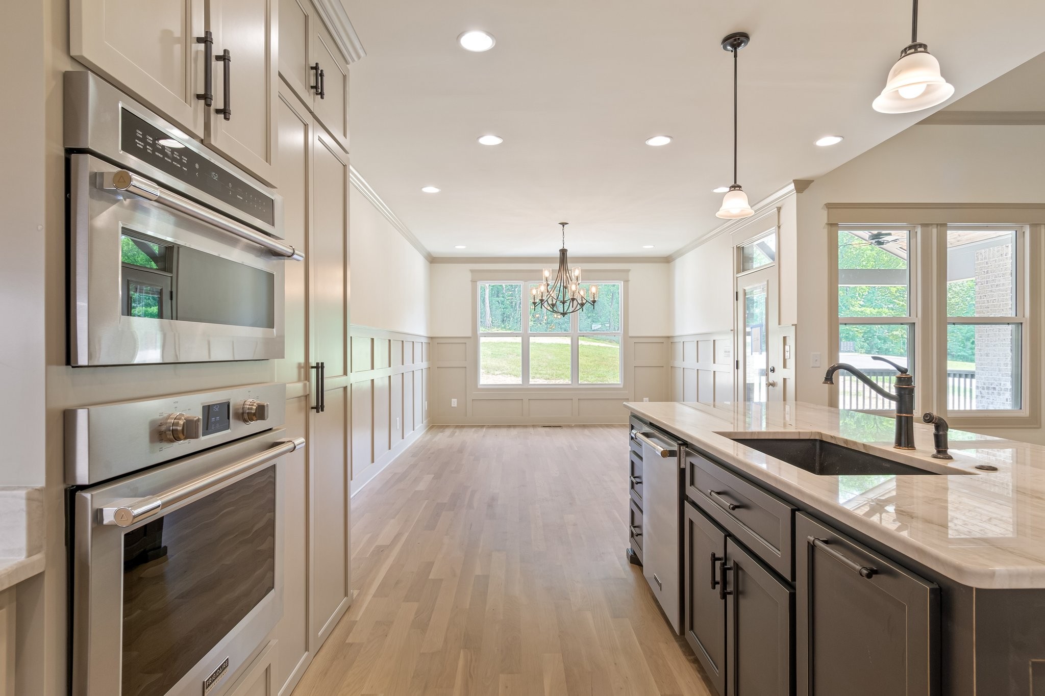 4100 Affiant Way Culleoka, TN 38451 - Photo 11 of 27 a kitchen with a sink stove and wooden floor