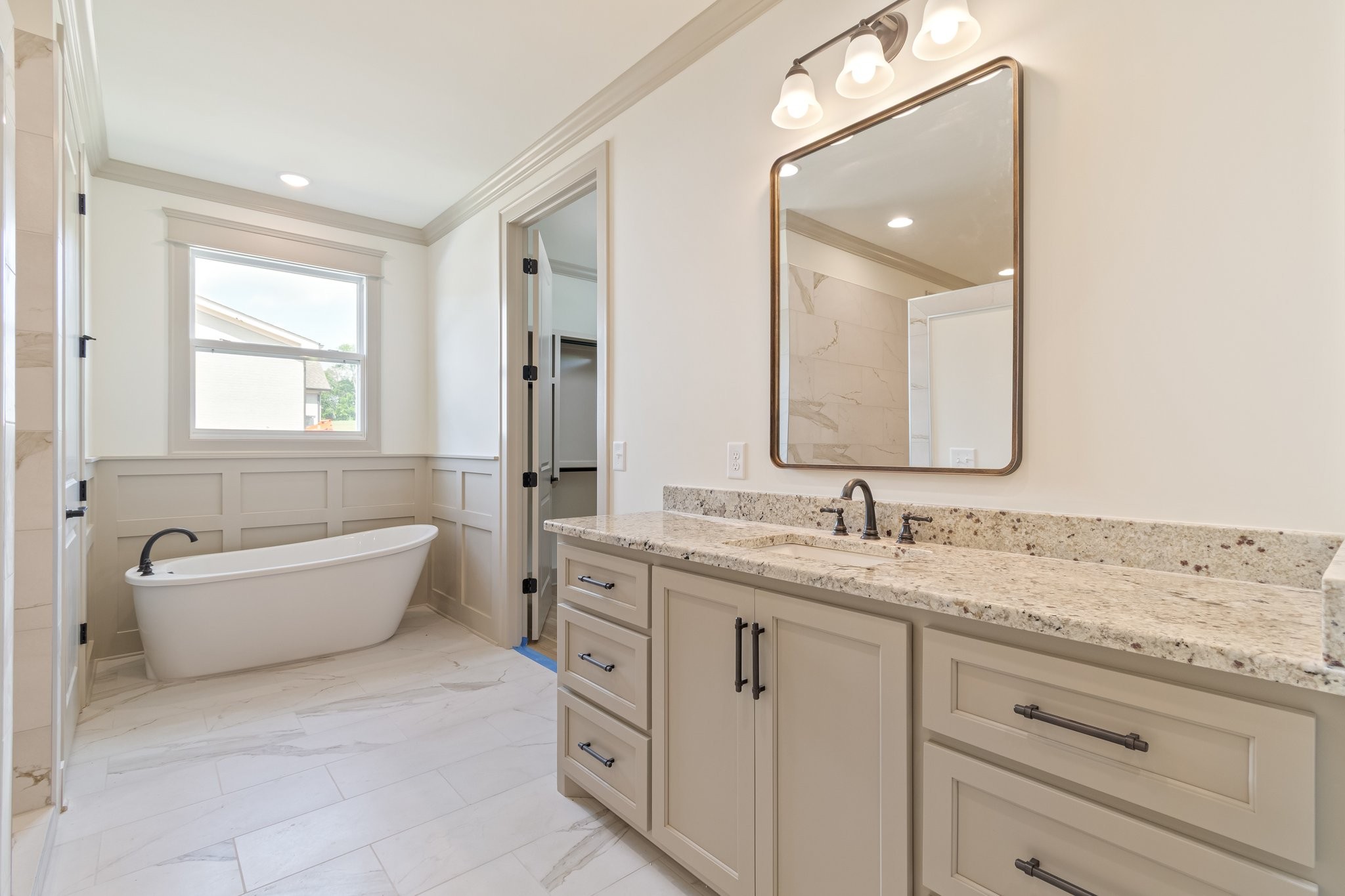 4100 Affiant Way Culleoka, TN 38451 - Photo 15 of 27 a bathroom with a granite countertop sink mirror and bathtub