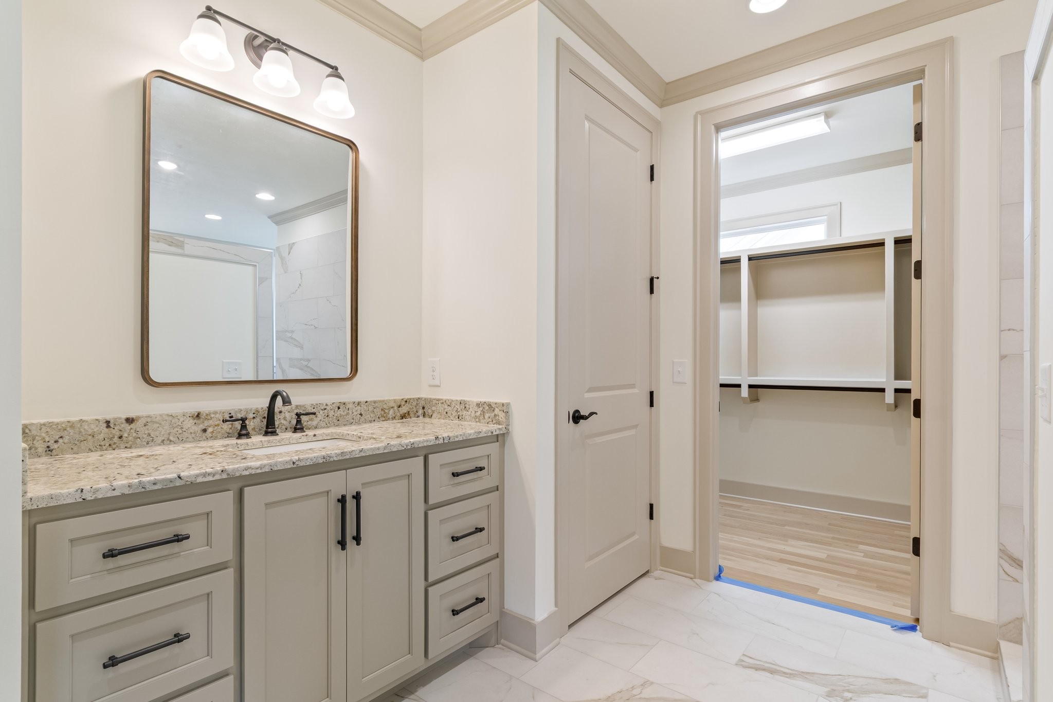 4100 Affiant Way Culleoka, TN 38451 - Photo 17 of 27 a bathroom with a double vanity sink and mirror