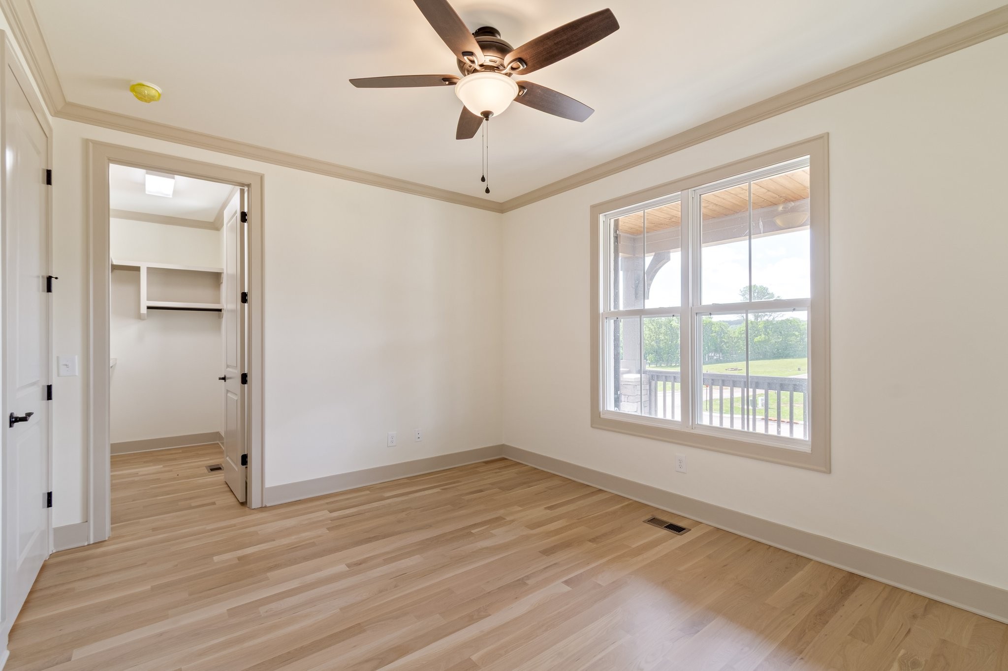 4100 Affiant Way Culleoka, TN 38451 - Photo 19 of 27 a view of an empty room with a window and a ceiling fan