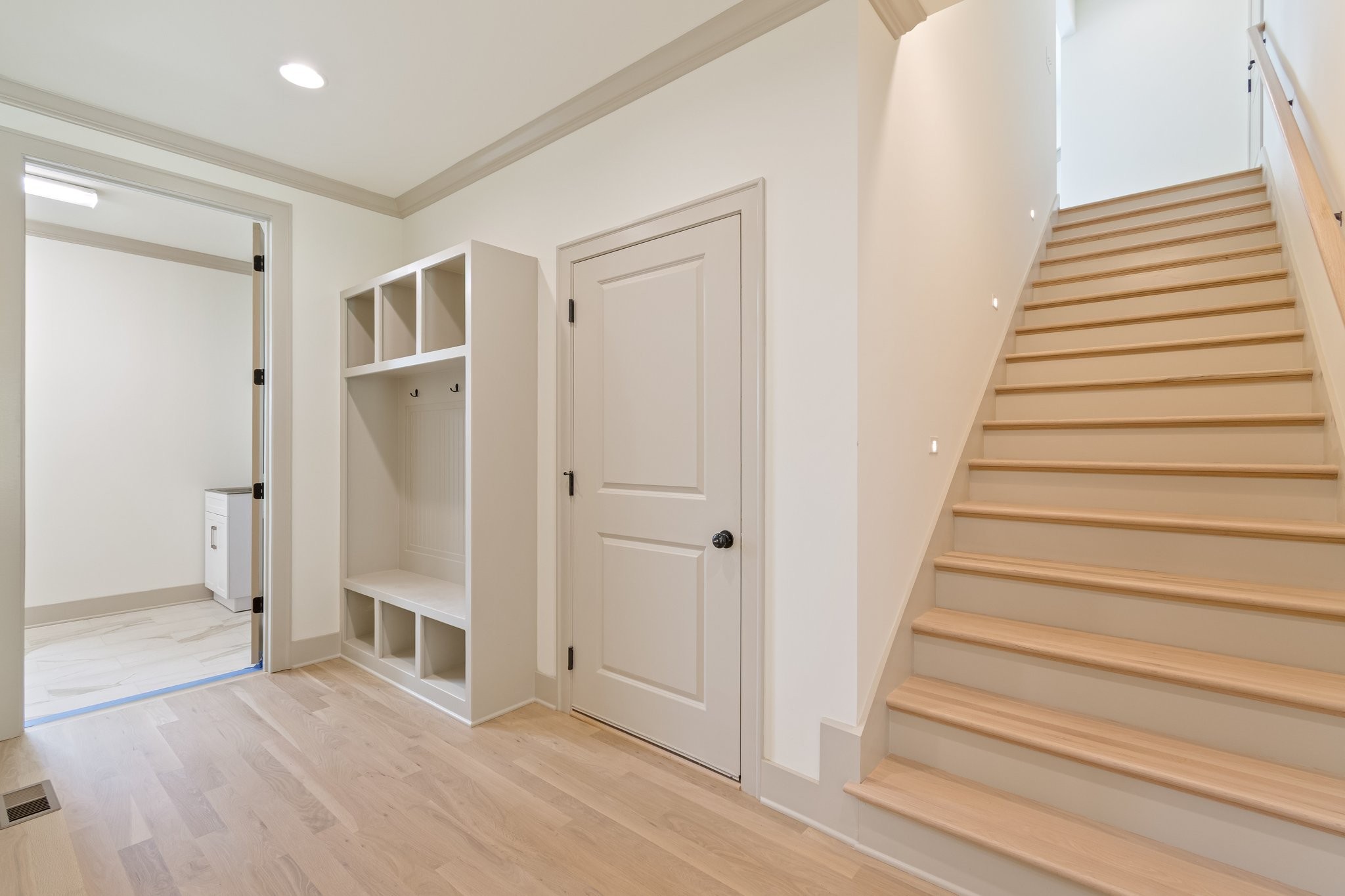 4100 Affiant Way Culleoka, TN 38451 - Photo 22 of 27 a view of entryway with wooden floor and stairs
