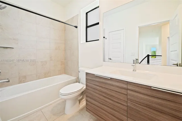 a bathroom with a sink a toilet and a bathtub