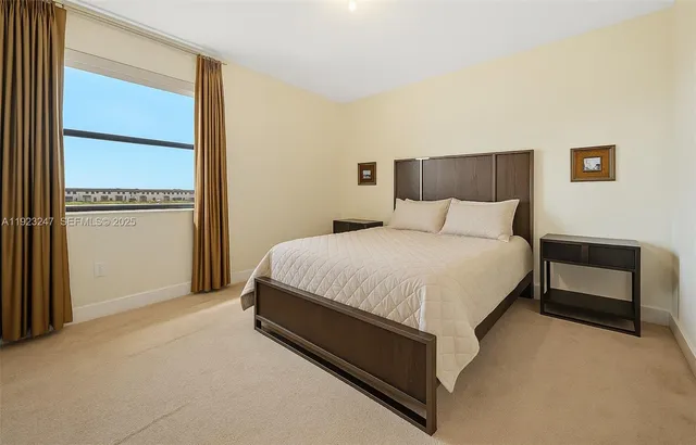 a bed room with a bed and a window