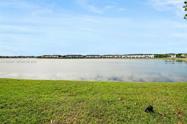 a view of a lake with a big yard