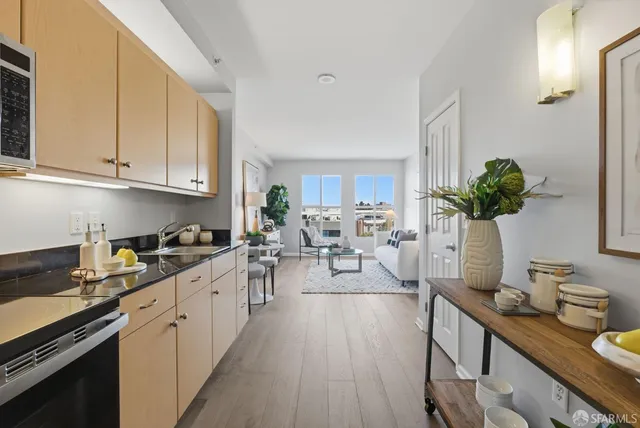 a view of kitchen with sink and cabinets