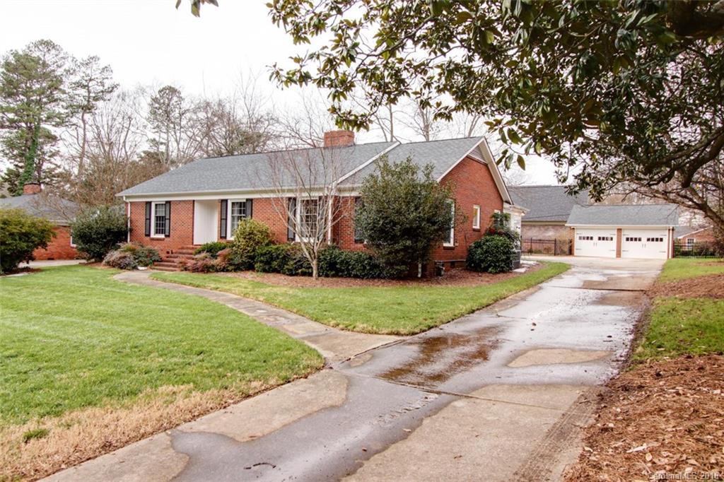 1400 Ferncliff Road Charlotte, NC 28211 - Photo 2 of 21 a front view of a house with a yard and trees