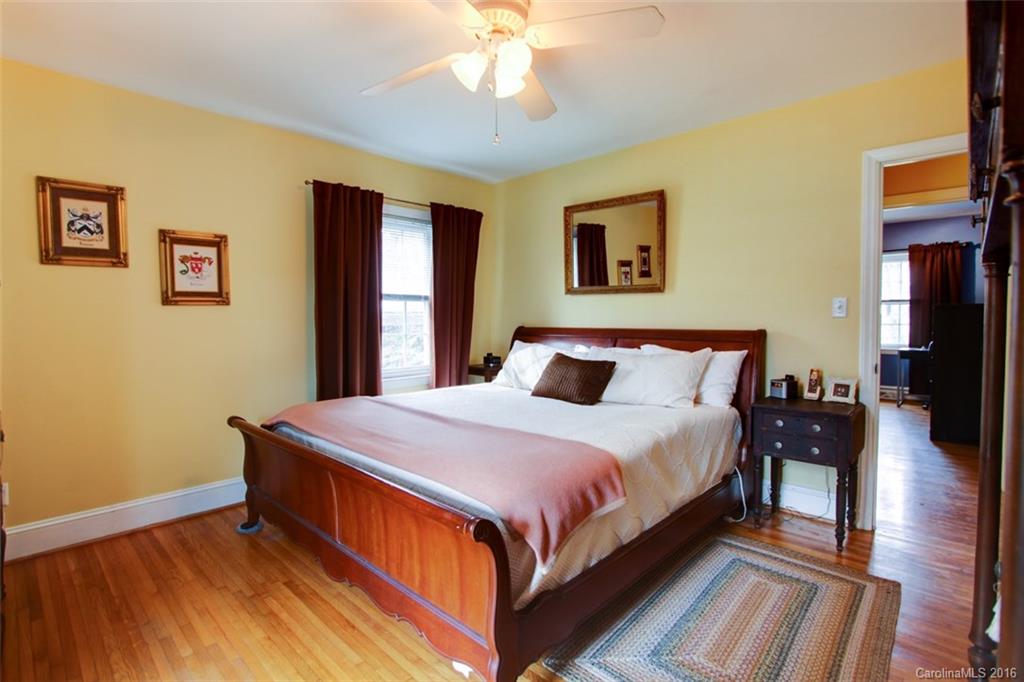 1400 Ferncliff Road Charlotte, NC 28211 - Photo 13 of 21 a large bed sitting in a bedroom next to a window