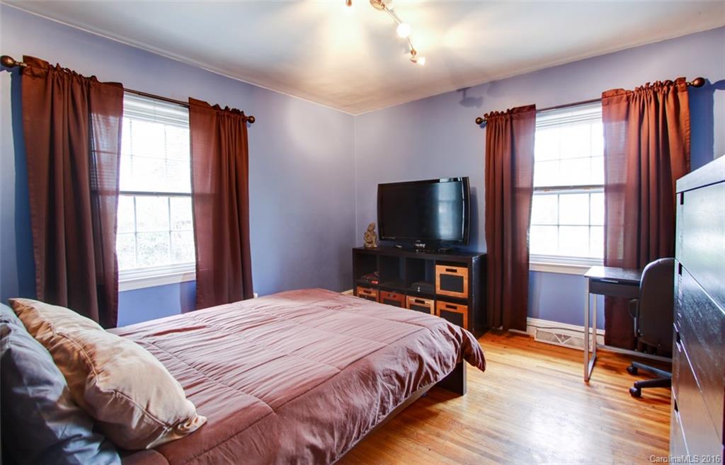 1400 Ferncliff Road Charlotte, NC 28211 - Photo 15 of 21 a bedroom with a bed and a flat screen tv