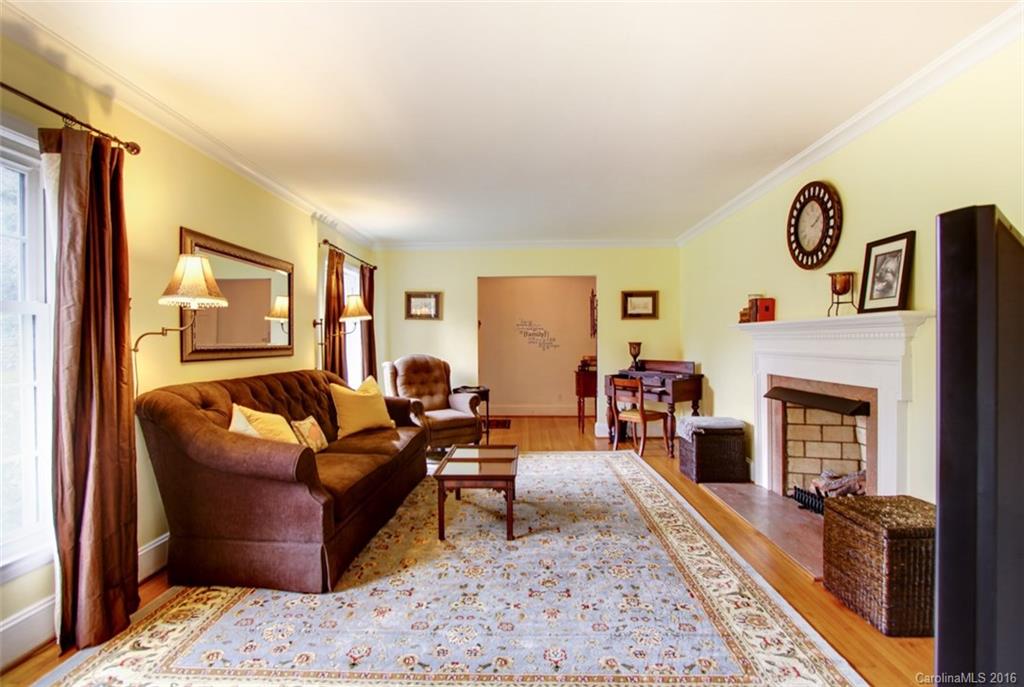 1400 Ferncliff Road Charlotte, NC 28211 - Photo 4 of 21 a living room with furniture and a fireplace