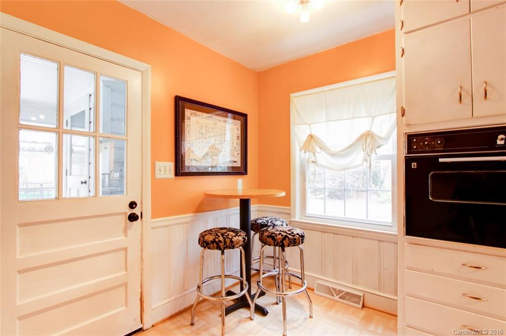 1400 Ferncliff Road Charlotte, NC 28211 - Photo 10 of 21 a living room with furniture a flat screen tv and a window