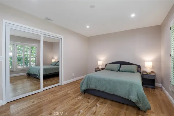 a bedroom with a bed and a view of bedroom
