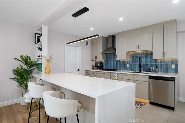 a kitchen with appliances and cabinets