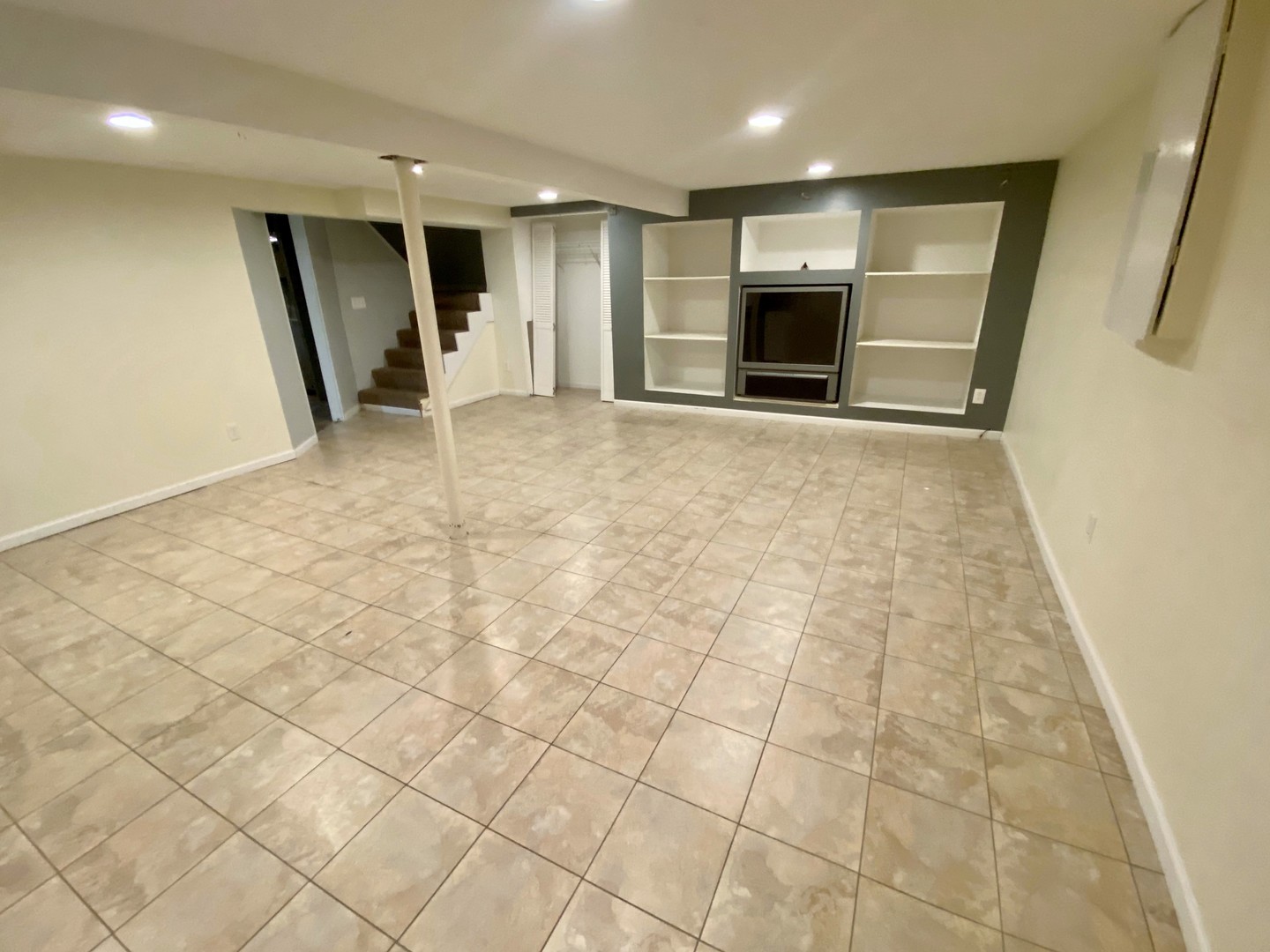 192 Roberts Road Bolingbrook, IL 60440 - Photo 22 of 26 an empty room with a fireplace and cabinet