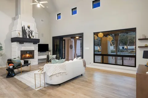 a living room with furniture and a fireplace
