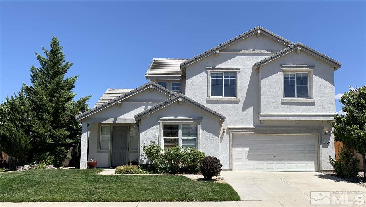 2525 Baton Drive Reno, NV 89521 - Photo 1 of 23 a front view of a house with garden
