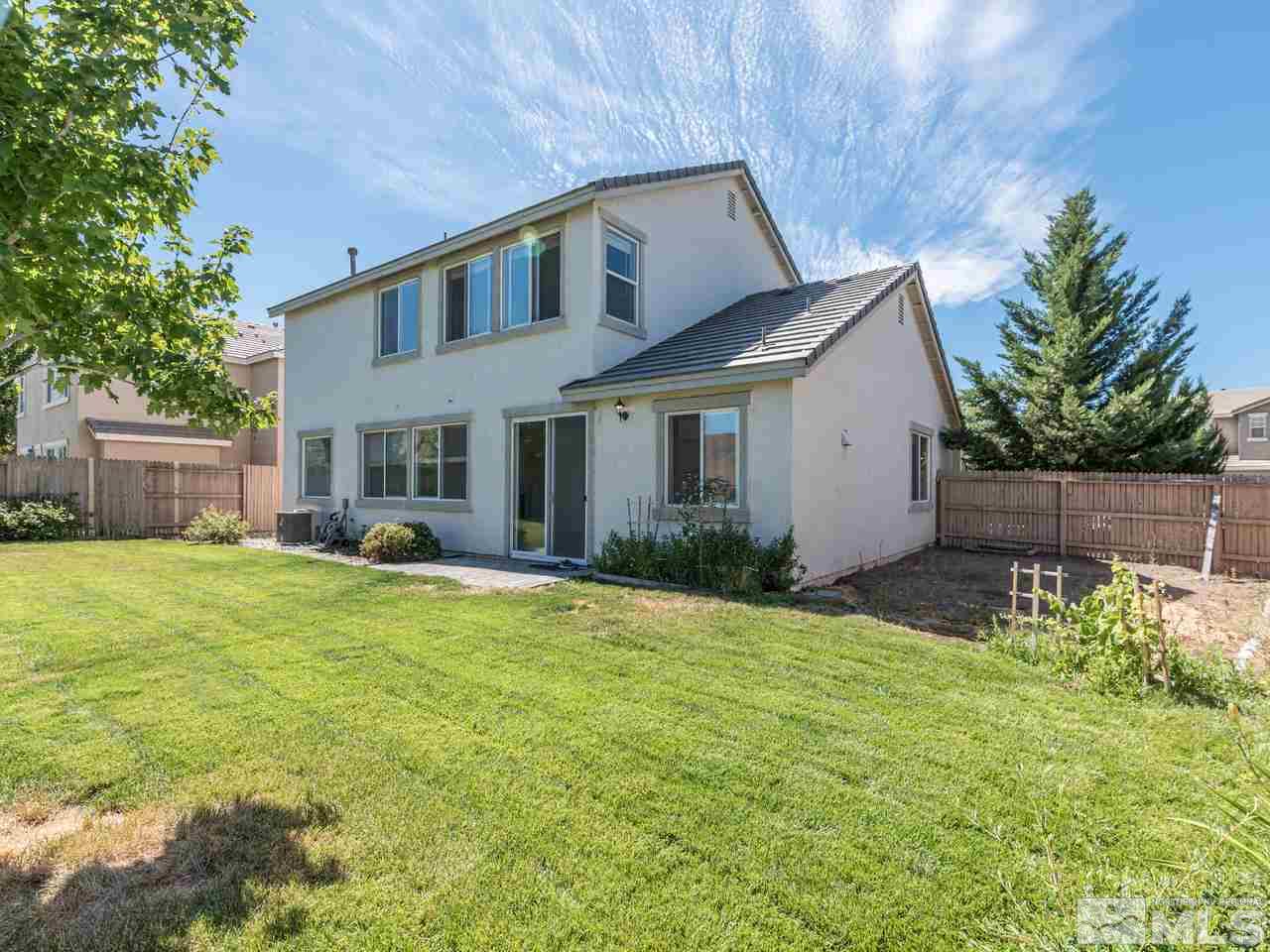 2525 Baton Drive Reno, NV 89521 - Photo 3 of 23 a front view of house with yard and trees