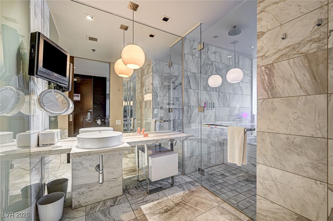 4381 West Flamingo Road, Unit 53307 Las Vegas, NV 89103 - Photo 13 of 45 Bathroom featuring a stall shower and vanity