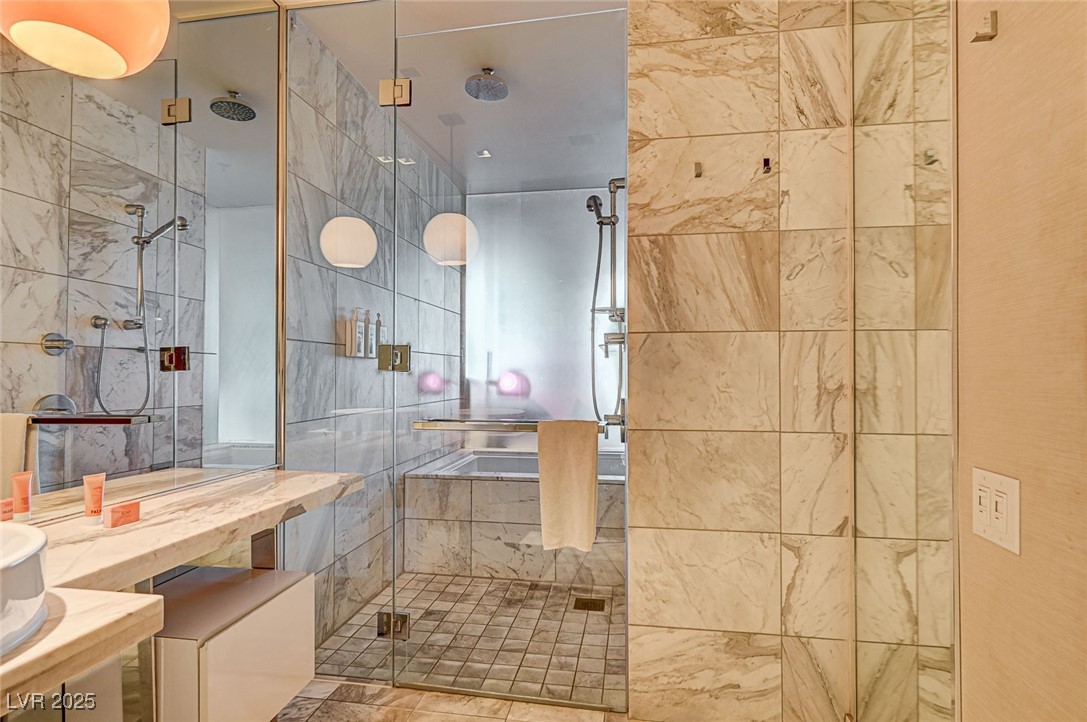 4381 West Flamingo Road, Unit 53307 Las Vegas, NV 89103 - Photo 14 of 45 Full bath with a shower stall and vanity