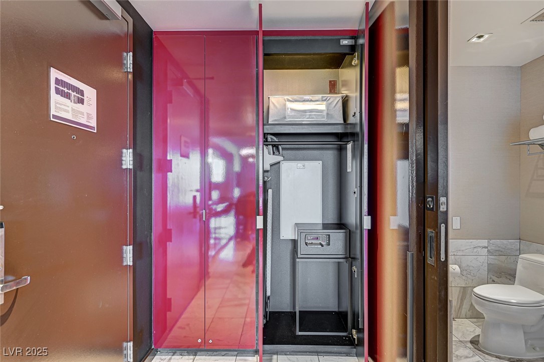 4381 West Flamingo Road, Unit 53307 Las Vegas, NV 89103 - Photo 19 of 45 Hall featuring tile walls