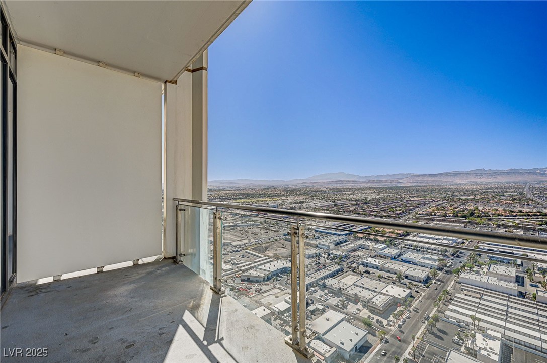 4381 West Flamingo Road, Unit 53307 Las Vegas, NV 89103 - Photo 21 of 45 Balcony with a view of city and a mountain view