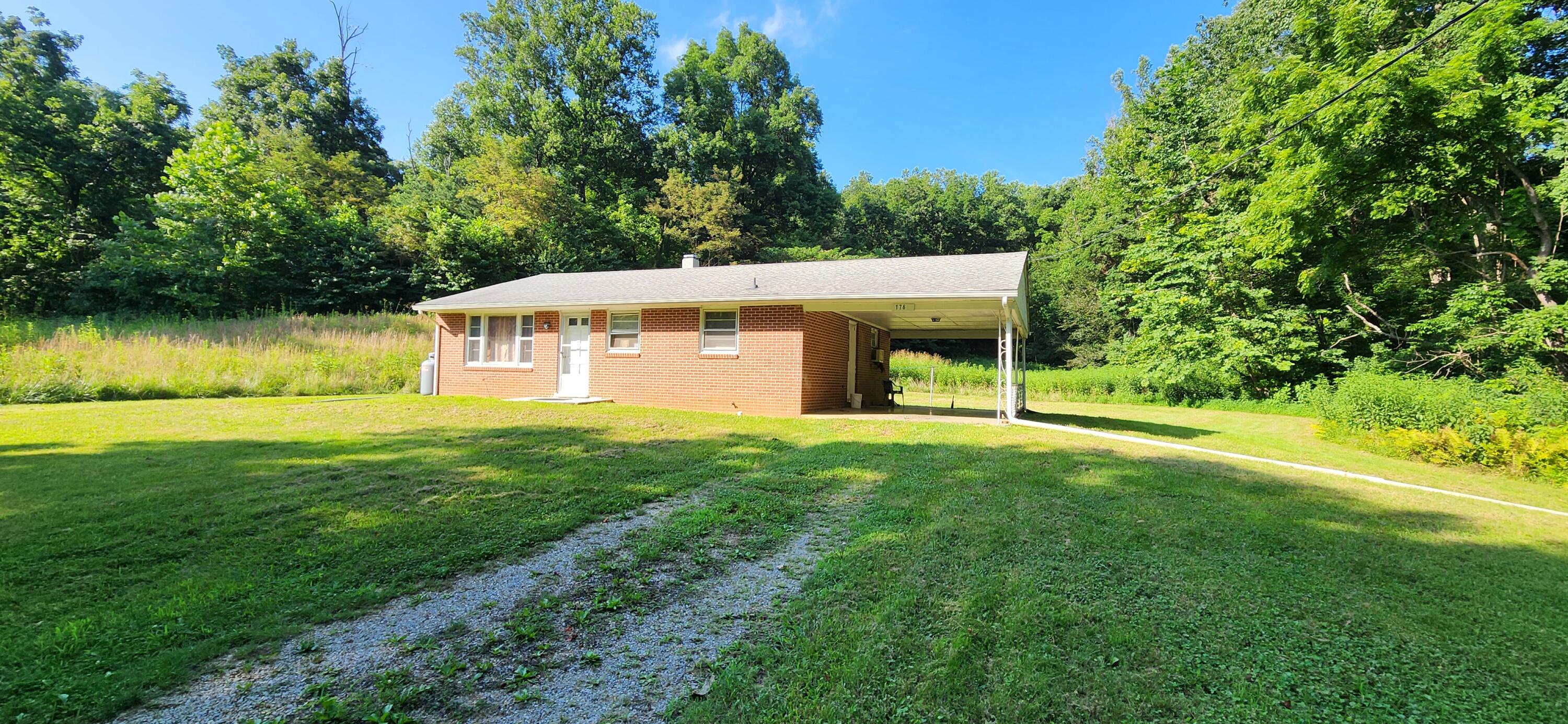 1762 Runnett Bag Road Ferrum, VA 24088 - Photo 11 of 14 a view of a house with a yard