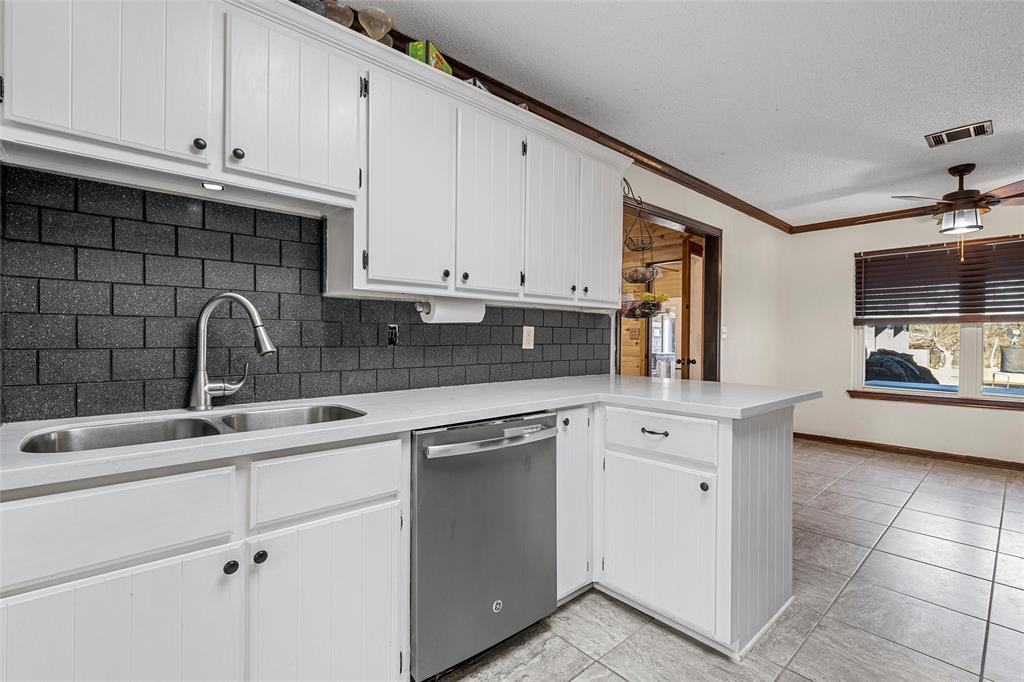 361 Vandiver Road Moody, TX 76557 - Photo 13 of 33 a kitchen with cabinets appliances a sink and a window