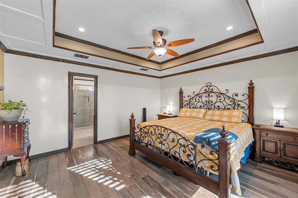 361 Vandiver Road Moody, TX 76557 - Photo 16 of 33 a bedroom with a bed and a chandelier