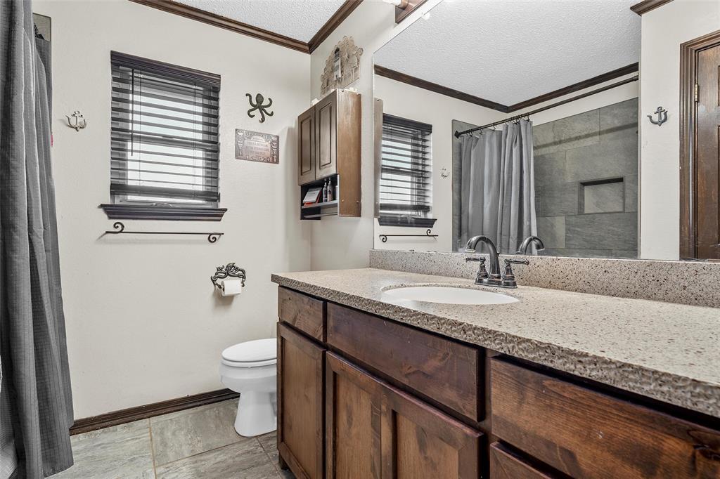 361 Vandiver Road Moody, TX 76557 - Photo 22 of 33 a bathroom with a granite countertop sink and a mirror