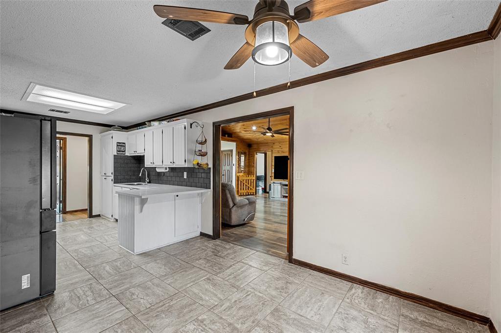 361 Vandiver Road Moody, TX 76557 - Photo 9 of 33 a kitchen with stainless steel appliances a refrigerator and microwave