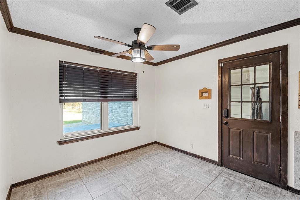 361 Vandiver Road Moody, TX 76557 - Photo 10 of 33 an empty room with chandelier fan and windows