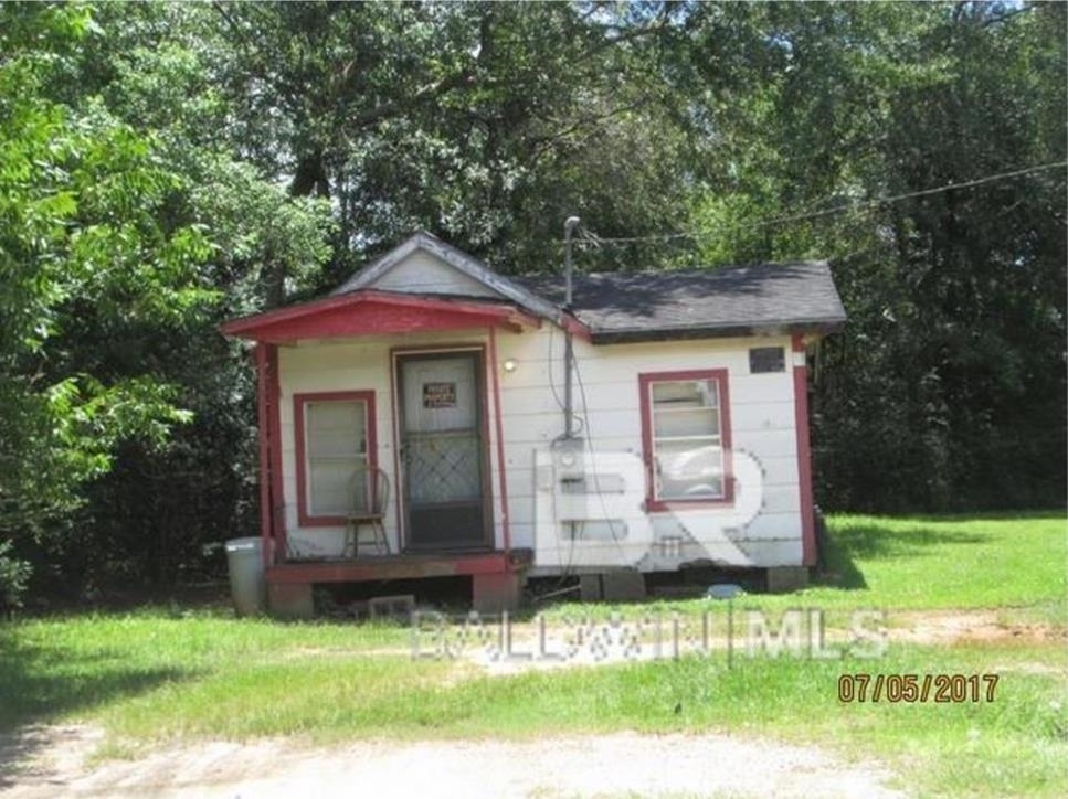 156 4th Street Atmore, AL 36502 - Photo 2 of 10 View of outdoor structure with view of wooded area