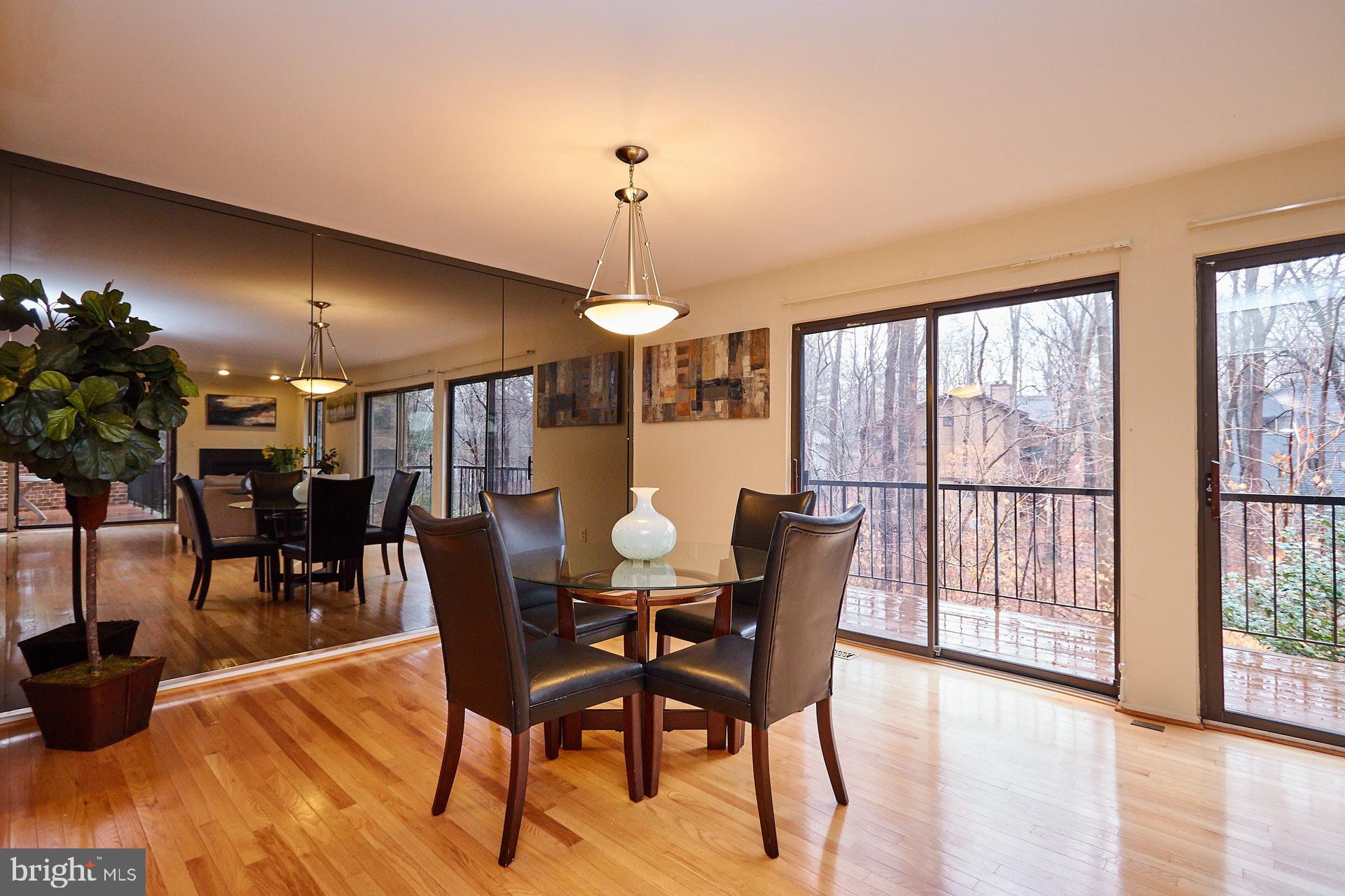 2113 Cabots Point Lane Reston, VA 20191 - Photo 3 of 56 a view of a dining room with furniture window and wooden floor