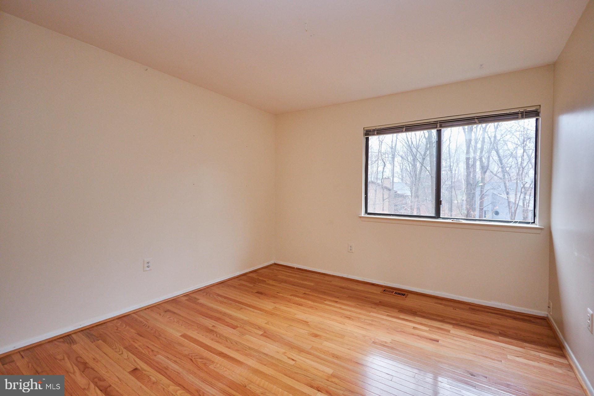 2113 Cabots Point Lane Reston, VA 20191 - Photo 20 of 56 a view of empty room with wooden floor and fan