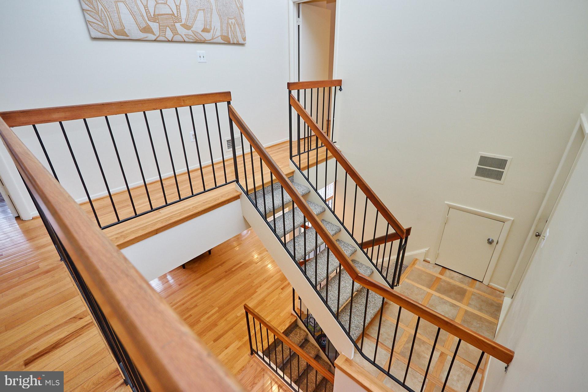2113 Cabots Point Lane Reston, VA 20191 - Photo 22 of 56 a view of staircase with black white walls
