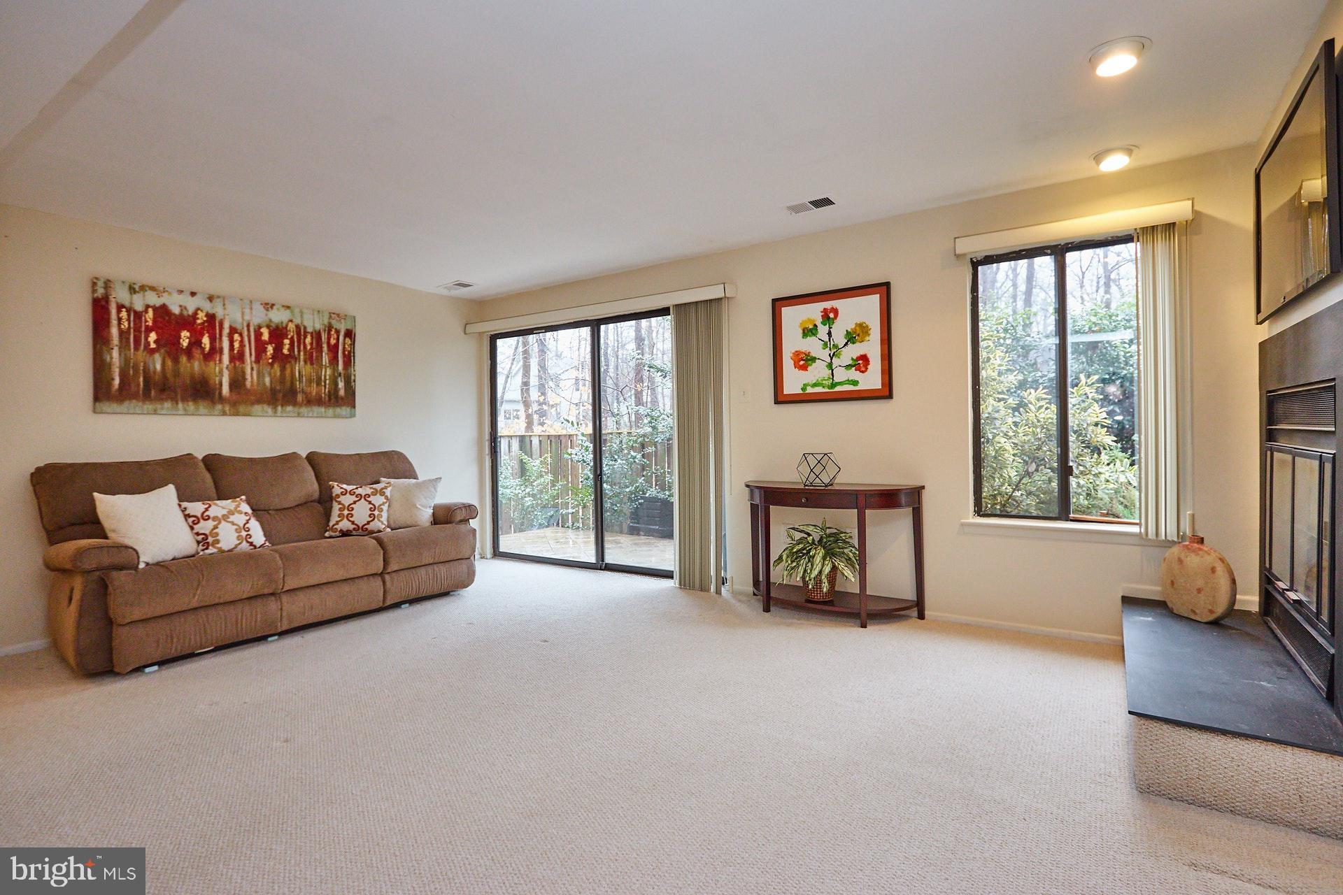 2113 Cabots Point Lane Reston, VA 20191 - Photo 23 of 56 a living room with furniture and a flat screen tv