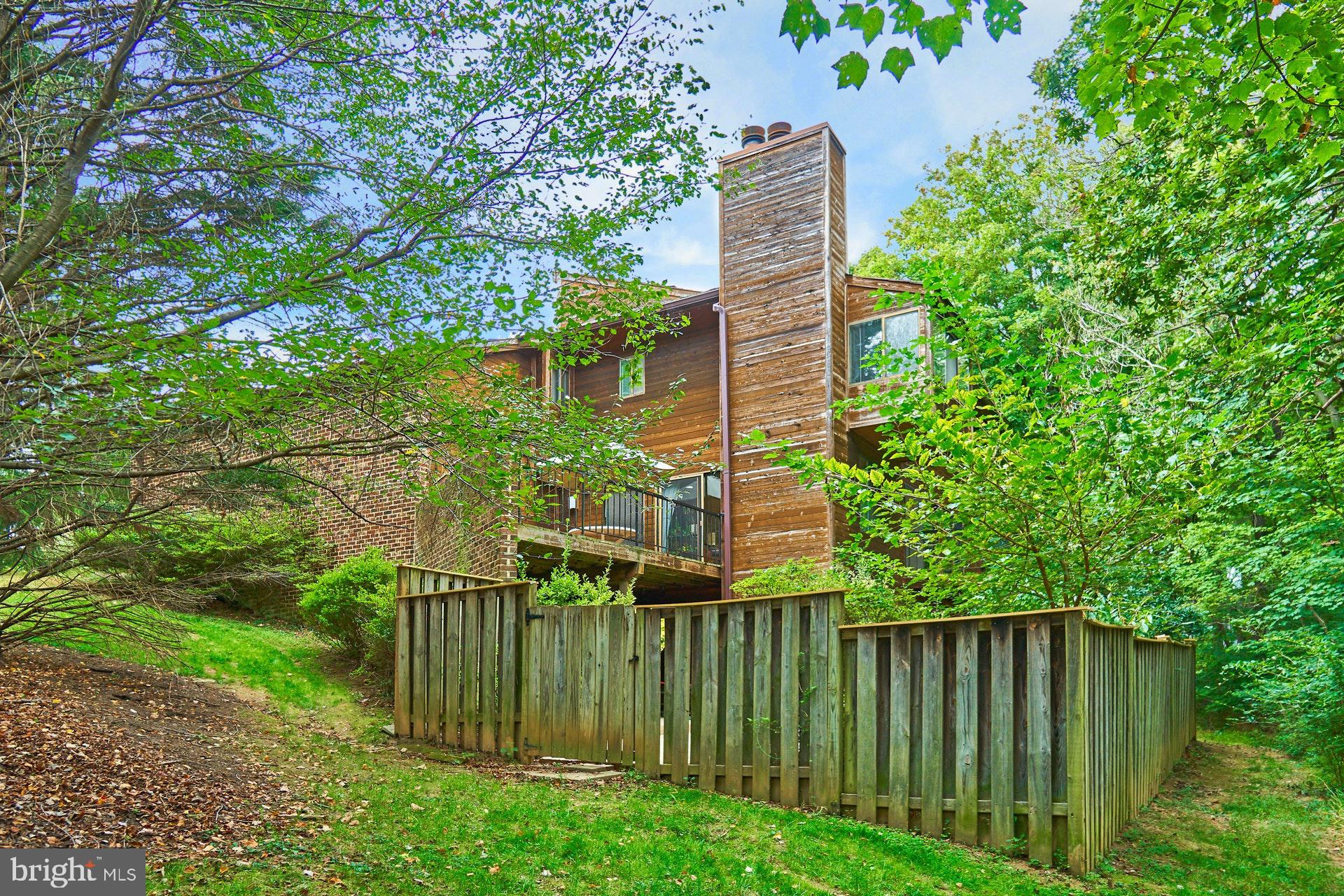 2113 Cabots Point Lane Reston, VA 20191 - Photo 34 of 56 a green field with trees in front of it