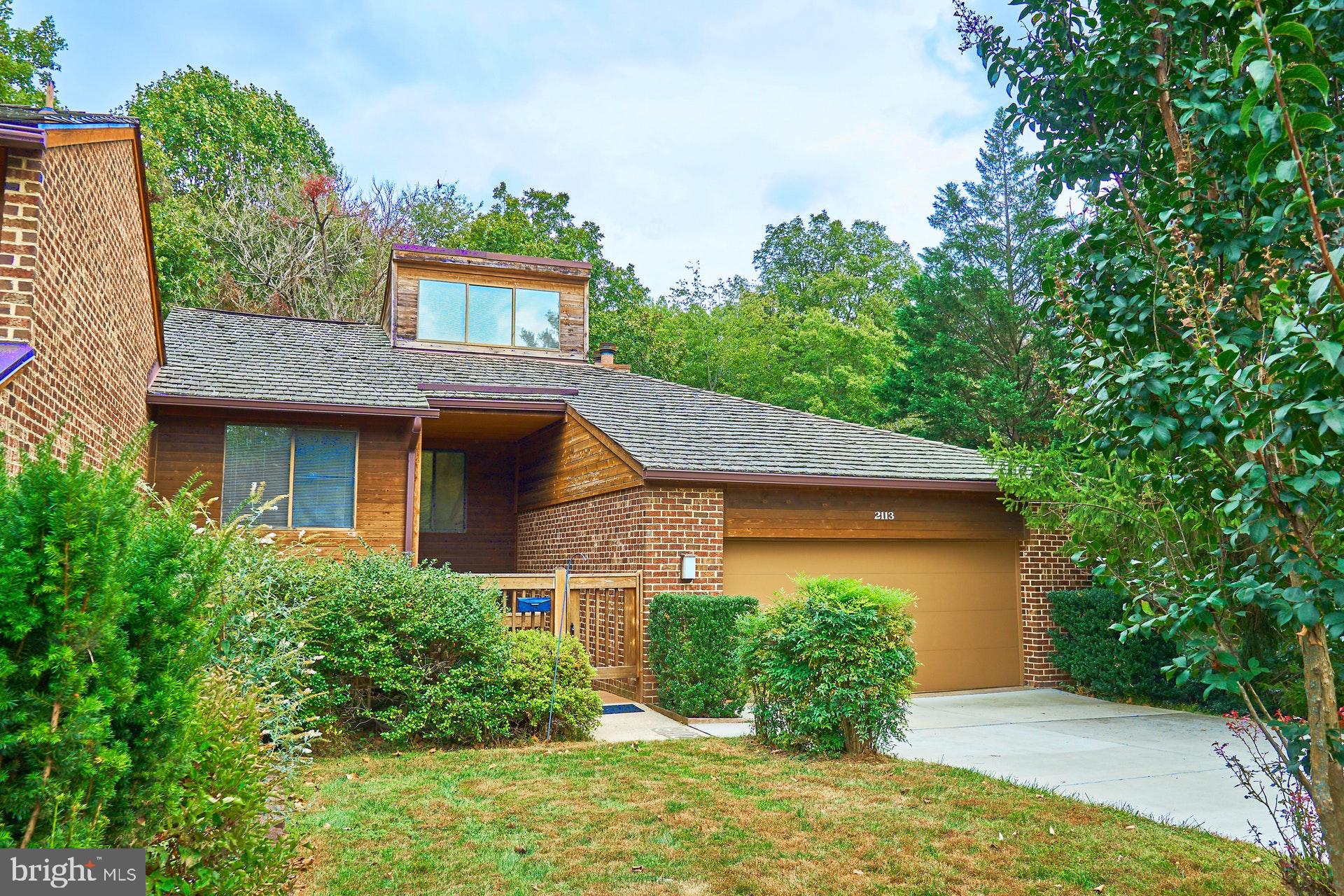 2113 Cabots Point Lane Reston, VA 20191 - Photo 35 of 56 front view of a house with a yard