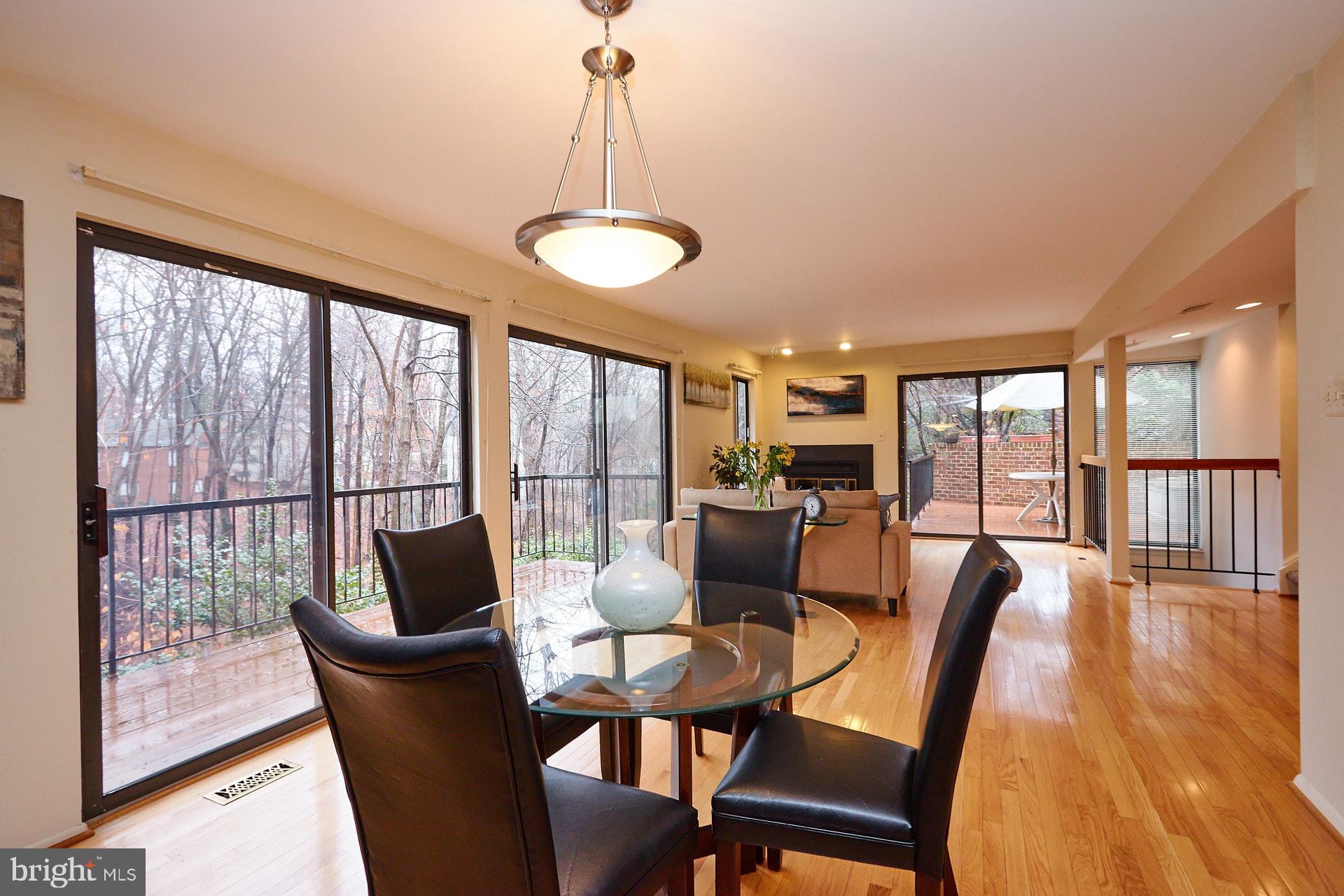 2113 Cabots Point Lane Reston, VA 20191 - Photo 4 of 56 a dining room with furniture a chandelier and wooden floor
